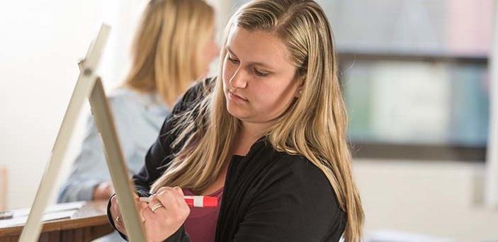 Student prepares class presentation